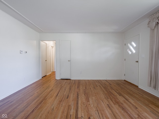 spare room featuring light hardwood / wood-style flooring