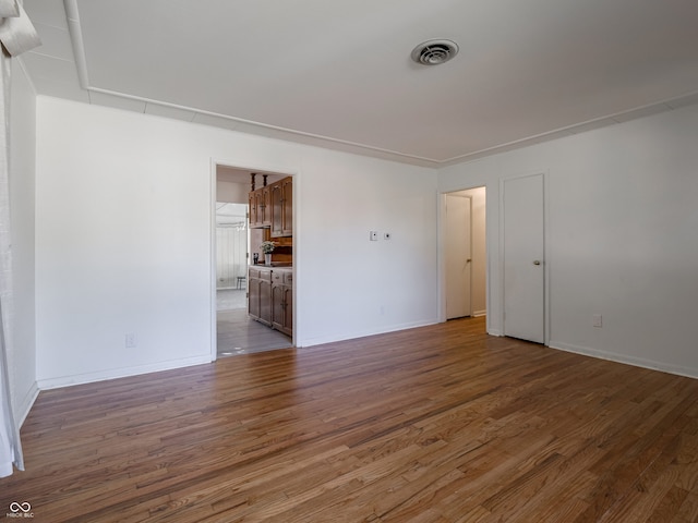 empty room featuring dark wood-type flooring