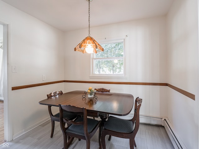 dining space with baseboard heating