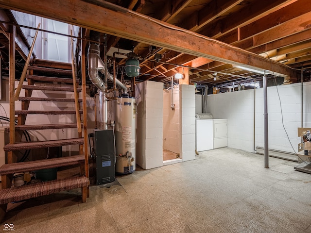 basement with gas water heater and washer and dryer