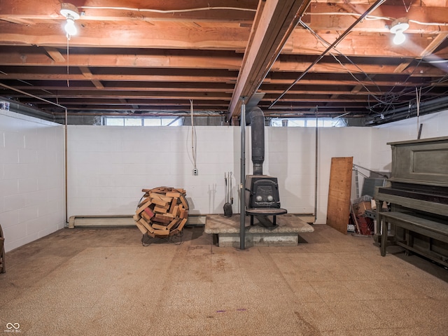 basement featuring a wood stove