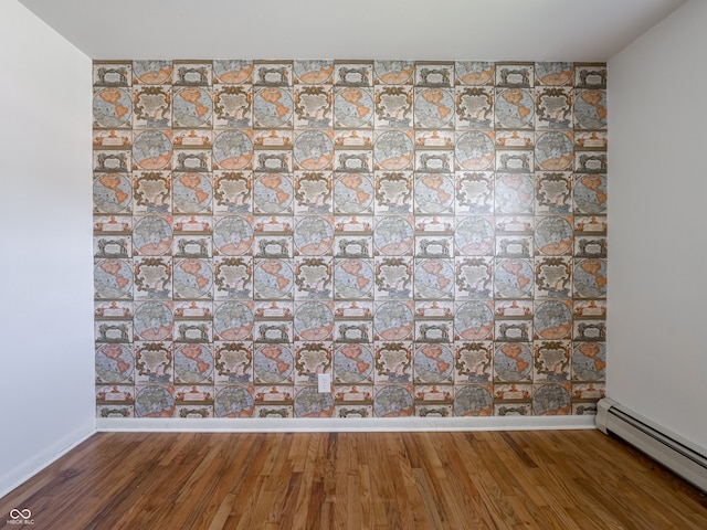 interior details featuring hardwood / wood-style floors and baseboard heating