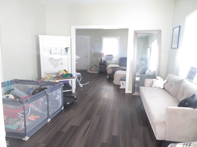 living room with dark hardwood / wood-style flooring