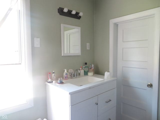 bathroom featuring vanity and a healthy amount of sunlight