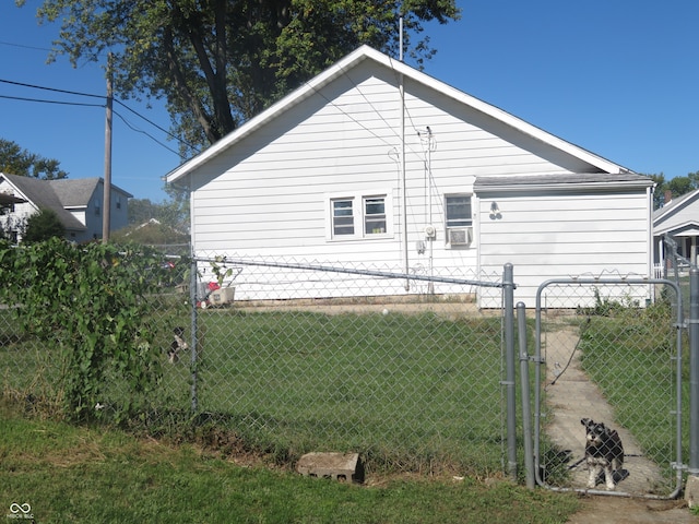 view of side of home featuring a yard