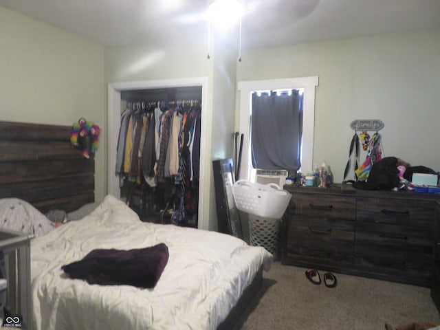 bedroom with carpet, a closet, and ceiling fan