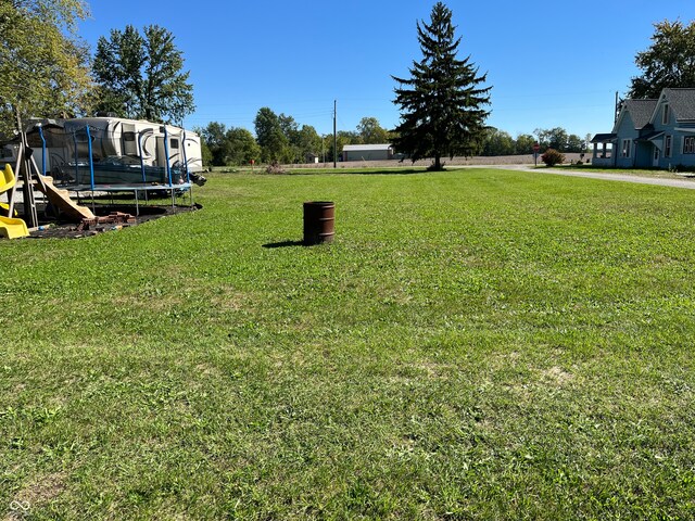 view of yard with a trampoline