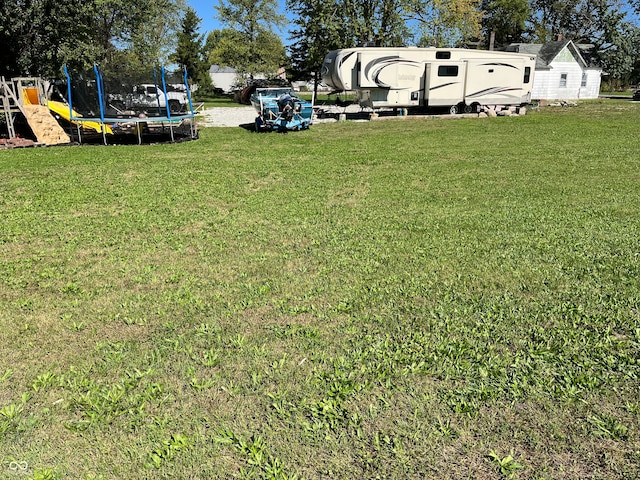 view of yard featuring a trampoline