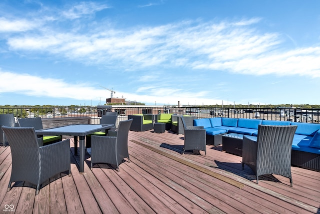 wooden terrace featuring outdoor lounge area