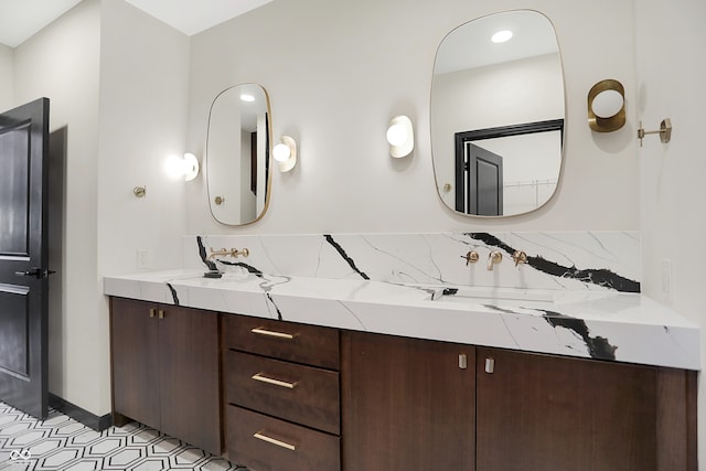 bathroom with vanity and backsplash