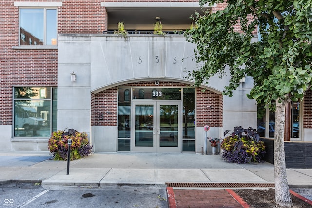 view of exterior entry featuring french doors