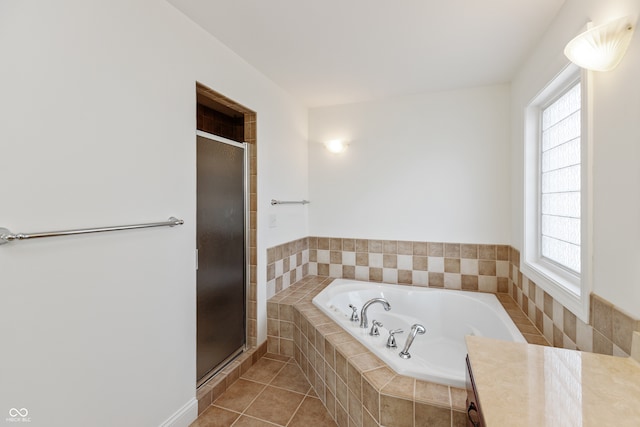 bathroom featuring tile patterned flooring, a wealth of natural light, and shower with separate bathtub