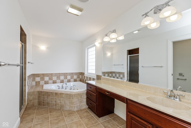 bathroom featuring vanity, tile patterned floors, and shower with separate bathtub