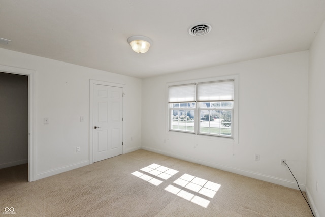 unfurnished bedroom with light colored carpet