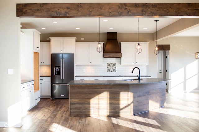 kitchen with custom range hood, white cabinetry, beamed ceiling, dark hardwood / wood-style floors, and high end fridge