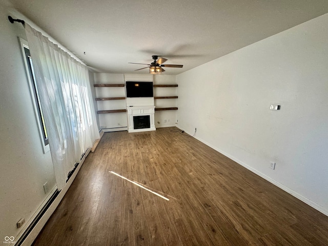 unfurnished living room featuring dark hardwood / wood-style flooring, ceiling fan, and a baseboard radiator