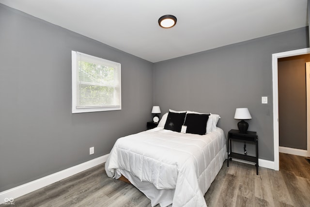 bedroom featuring hardwood / wood-style floors