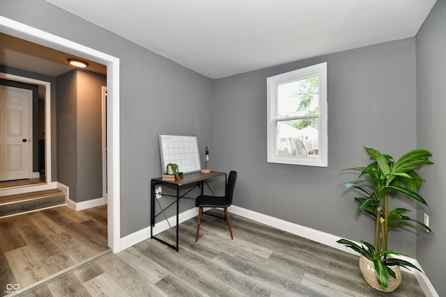 office area with light hardwood / wood-style floors