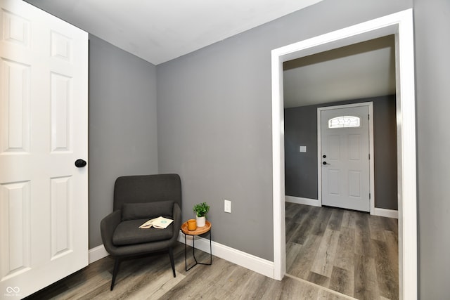 living area with hardwood / wood-style floors