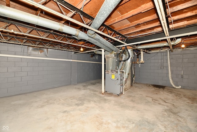 basement featuring heating unit