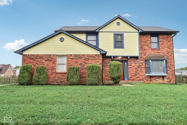 front facade featuring a front yard