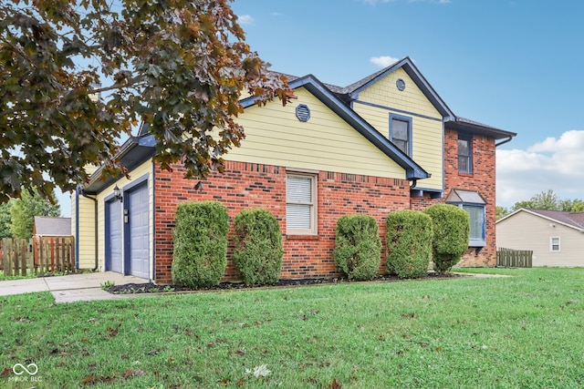 view of side of home featuring a lawn and a garage