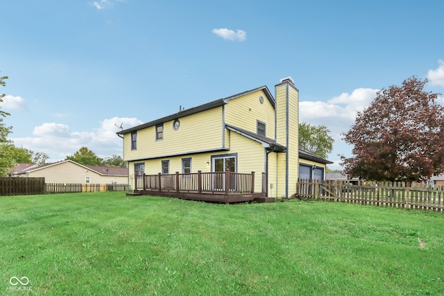 back of property featuring a deck and a lawn