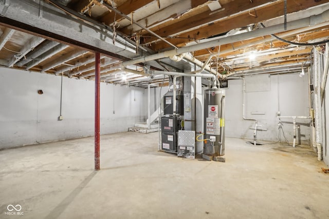 basement featuring heating unit and water heater