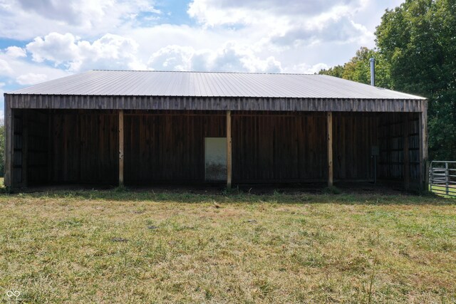 view of outbuilding with a yard