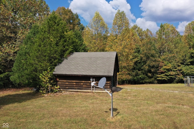 surrounding community featuring a yard and an outbuilding