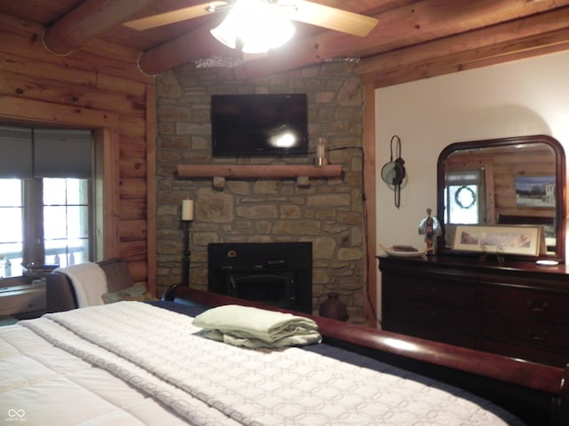 bedroom with beam ceiling, wooden ceiling, and ceiling fan