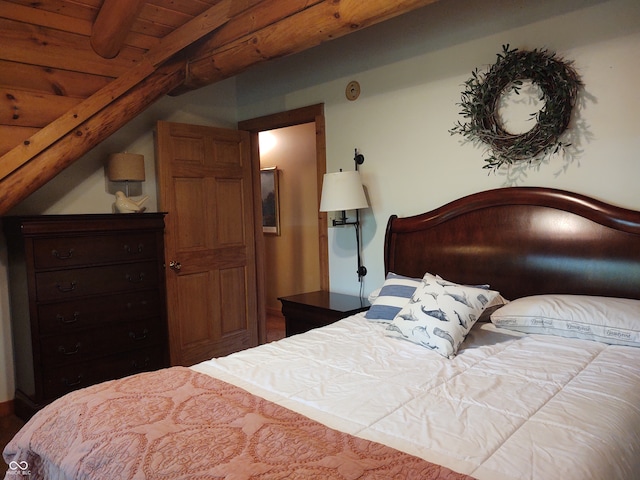 bedroom featuring vaulted ceiling with beams and wood ceiling