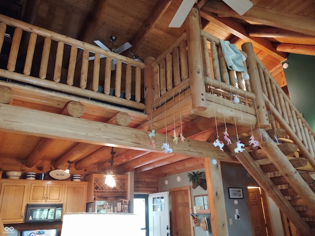 details featuring beamed ceiling, wood ceiling, and ceiling fan