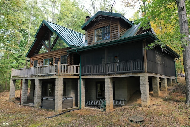 back of house with a sunroom