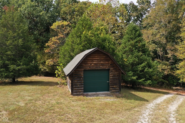 view of outbuilding with a lawn