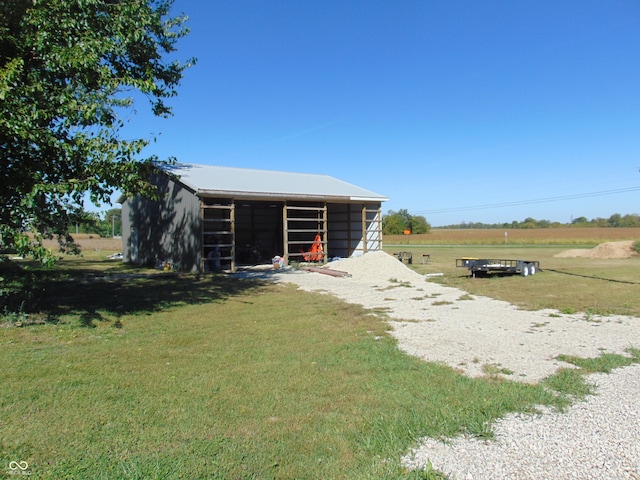 view of outbuilding featuring a rural view