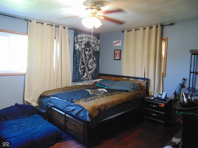 bedroom with hardwood / wood-style floors and ceiling fan