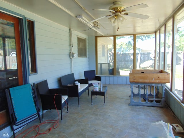 sunroom / solarium with ceiling fan