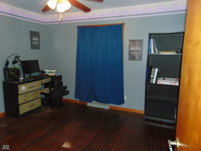 home office with dark hardwood / wood-style floors and ceiling fan