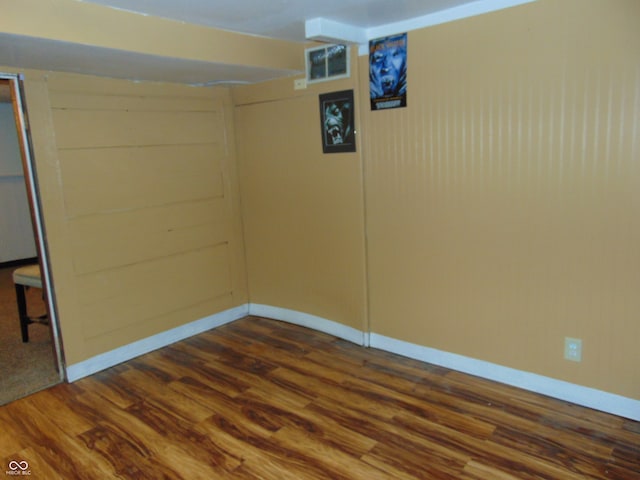 basement featuring dark hardwood / wood-style floors