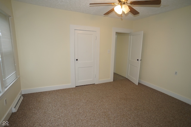 unfurnished bedroom with carpet, ceiling fan, and a textured ceiling