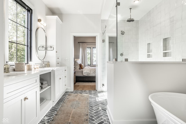 bathroom featuring plus walk in shower and vanity