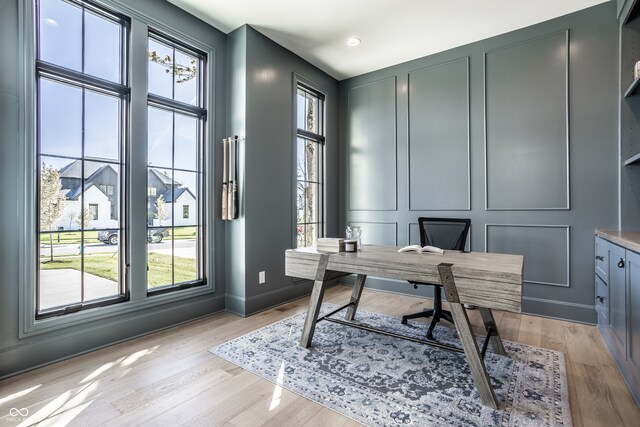 office space with light hardwood / wood-style floors