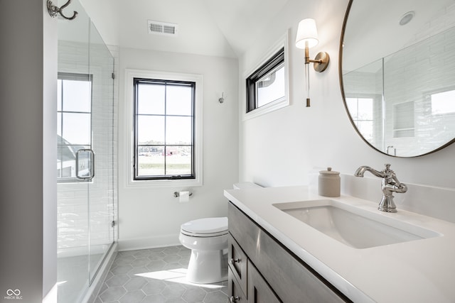 bathroom featuring walk in shower, tile patterned flooring, vanity, and toilet