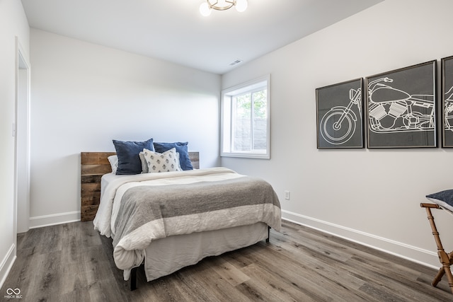 bedroom with wood-type flooring