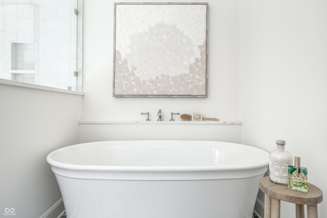 bathroom featuring a tub to relax in