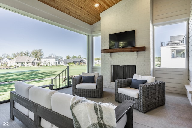 view of patio featuring an outdoor living space with a fireplace