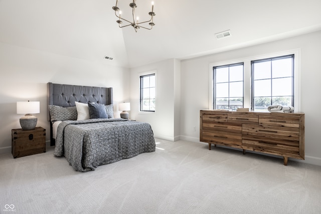 bedroom featuring light colored carpet, a chandelier, and vaulted ceiling