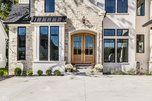 entrance to property featuring french doors