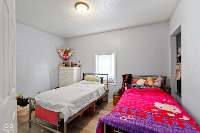 bedroom with wood-type flooring